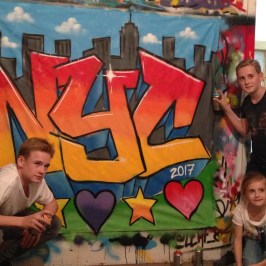 Simon Fenton holding a sign