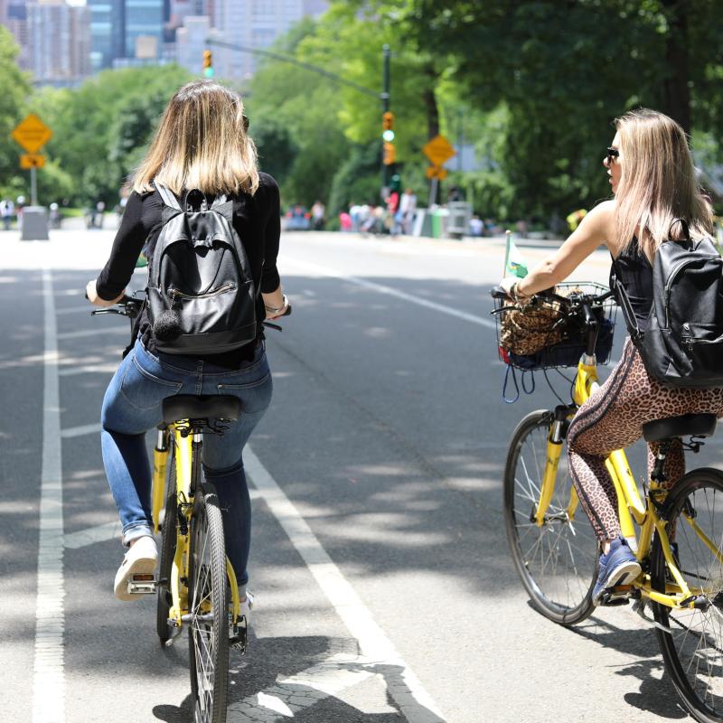 a person riding a bicycle on a city street